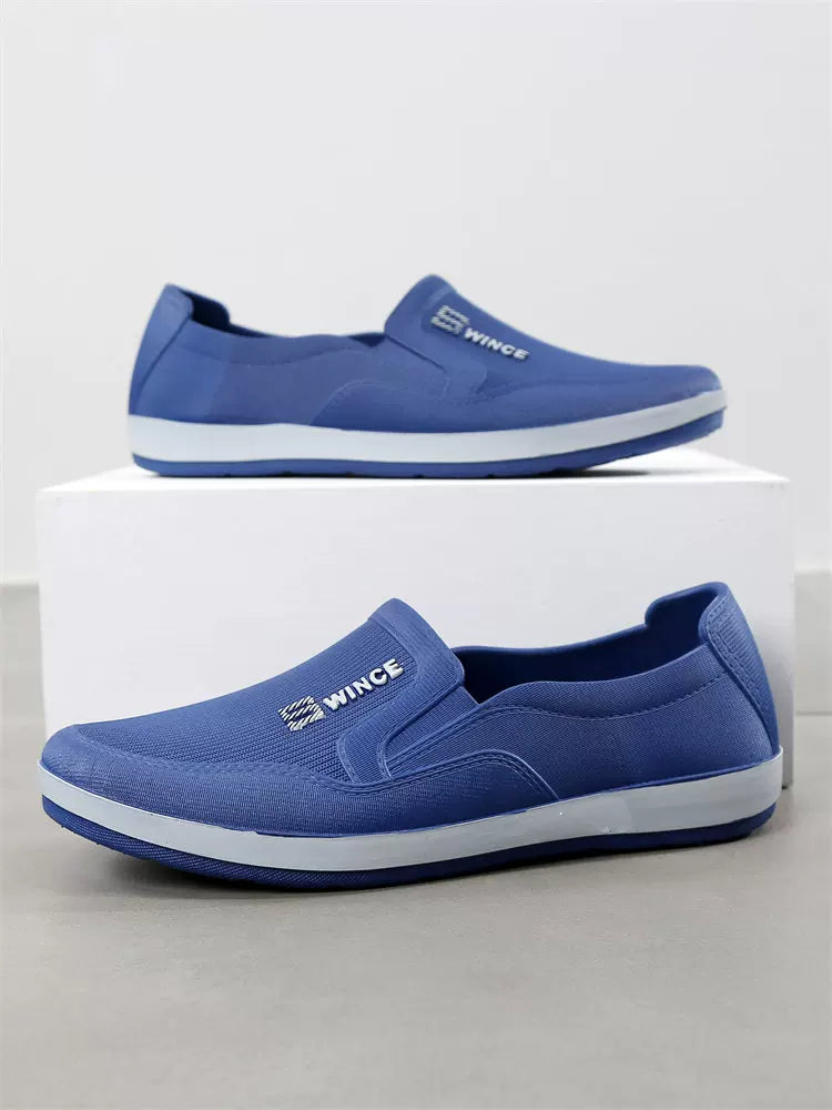 Sininen slip-on tennari sivukuva valkoisella pohjalla — Helvenza