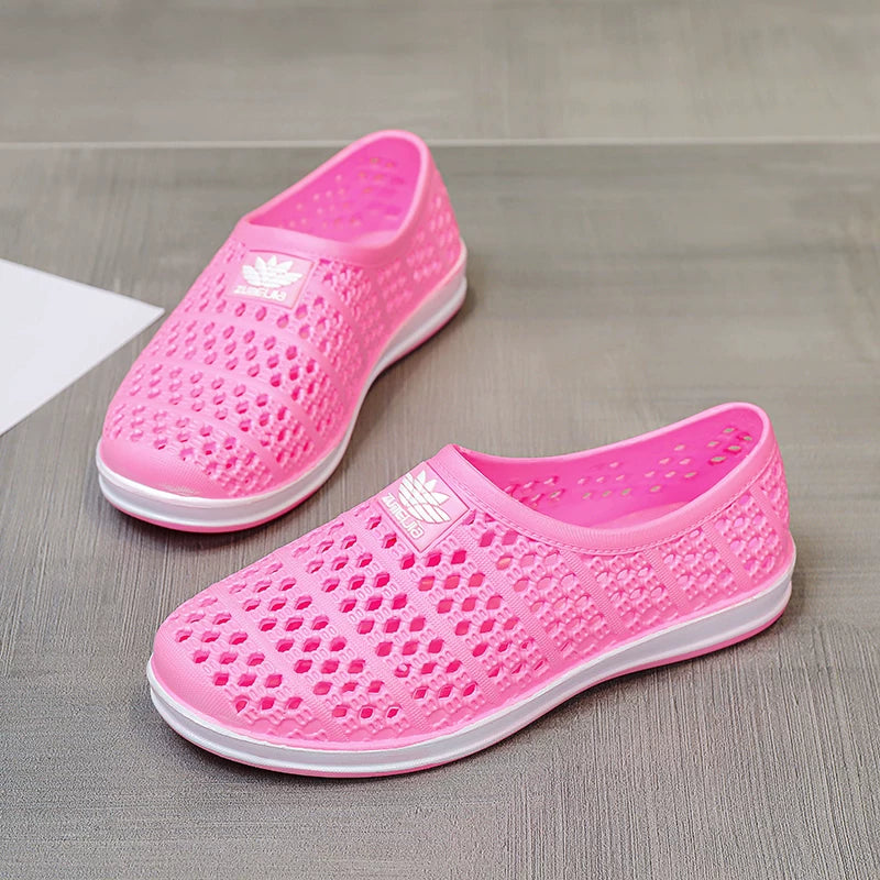 Vaaleanpunainen rei'itetty slip-on-loafer tasopintanäkymä parista — Helvenza