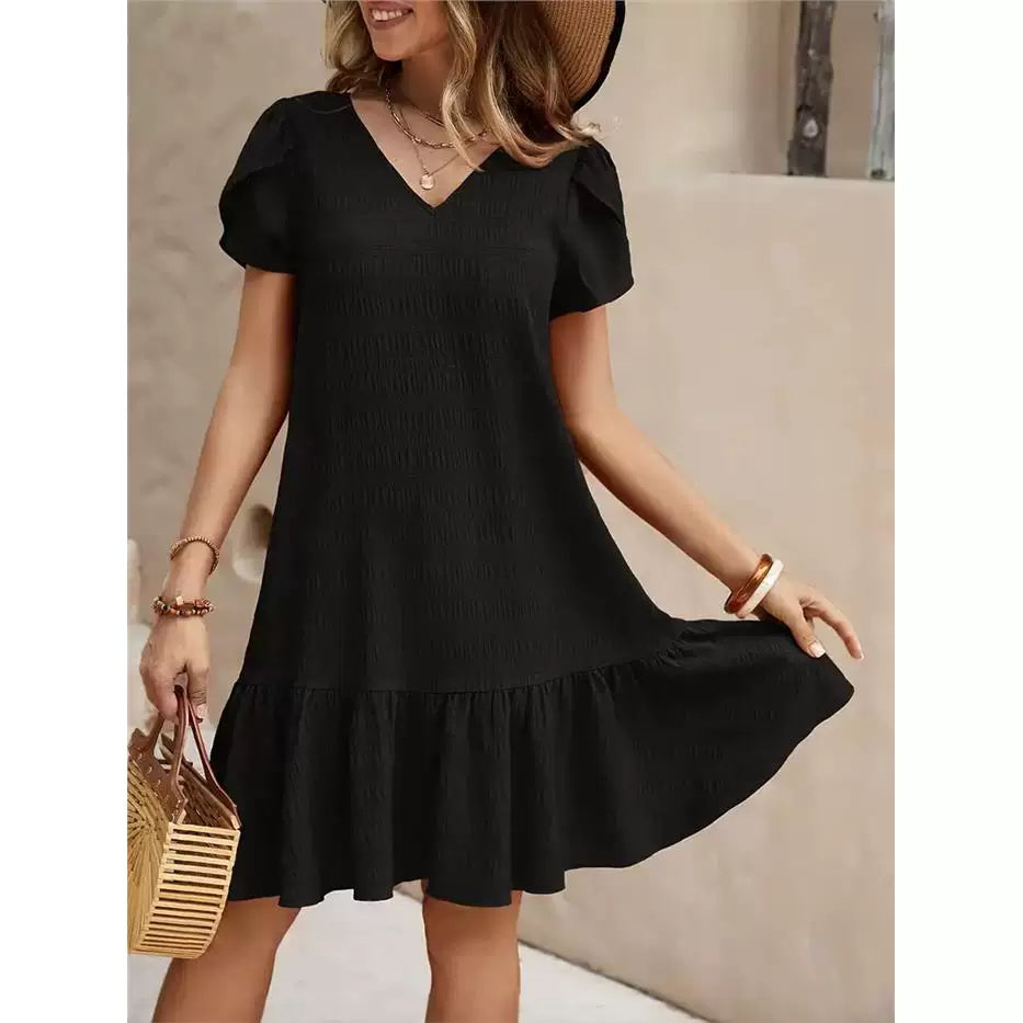Musta röyhelömekko puhvihihoilla tekstuurikangas edestä — Helvenza